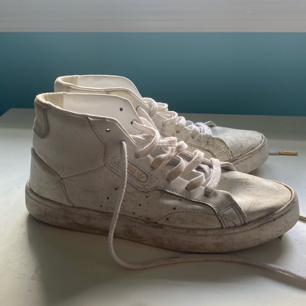 Well-worn ladies Adidas shoes